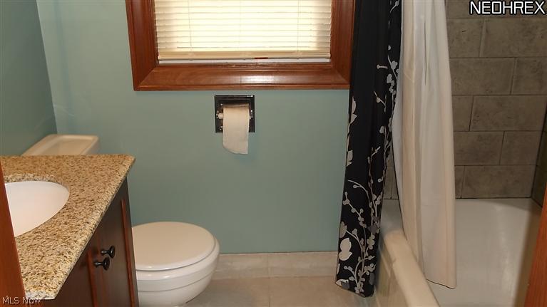 4335 7th Street Northwest Canton, OH 44708 - Photo 9 of 21 The Bath has been updated with vanity, tile work and wood trim (see the window)