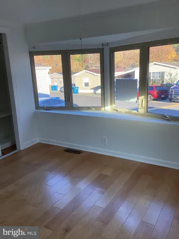 a bathroom with a shower and a sink