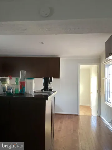 a view of a hallway with a white walls