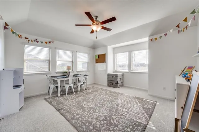 a dining room with wooden floor and a window