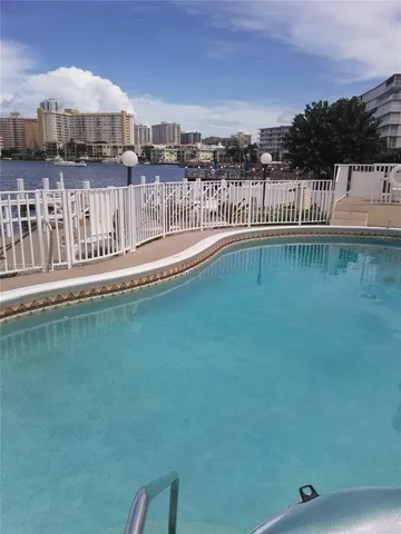 a view of a swimming pool with a lake view