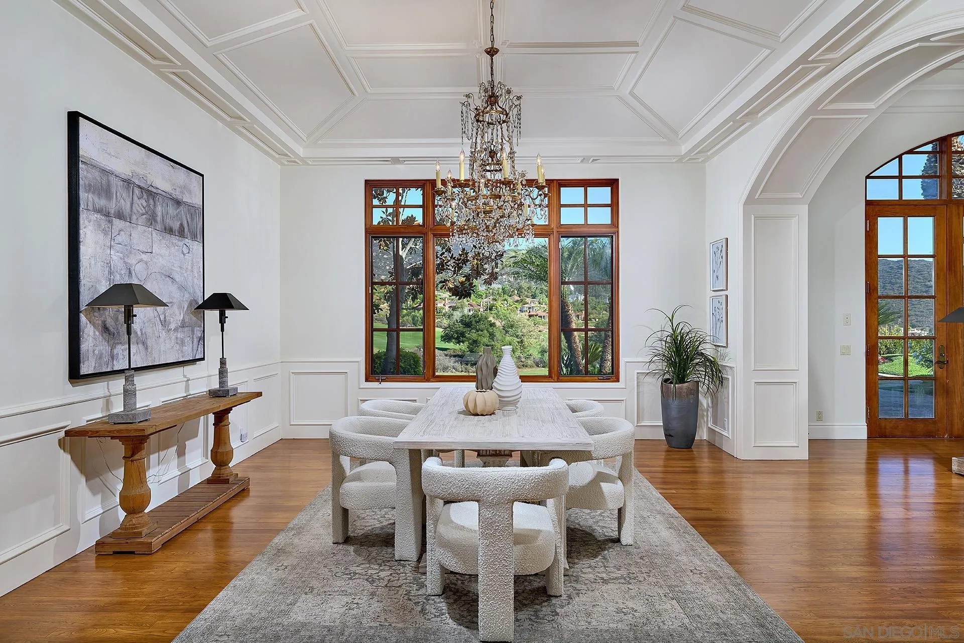 14155 Biscayne Place Poway, CA 92064 - Photo 12 of 54 a dining room with wooden floor a chandelier a glass table and windows