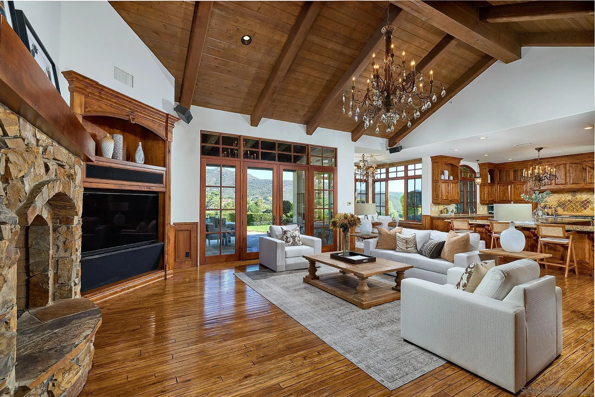 14155 Biscayne Place Poway, CA 92064 - Photo 15 of 56 a living room with patio furniture and a fireplace