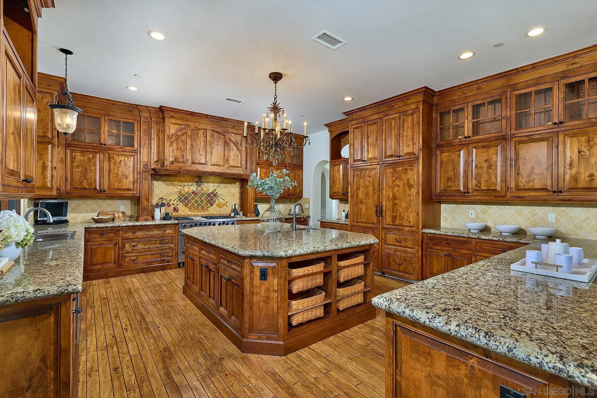 14155 Biscayne Place Poway, CA 92064 - Photo 20 of 54 a kitchen with stainless steel appliances granite countertop a stove a sink and a refrigerator