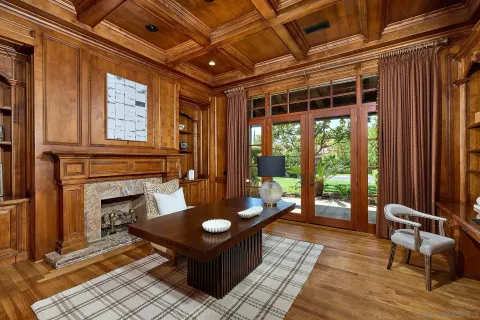 a spacious bedroom with a bed and a fireplace