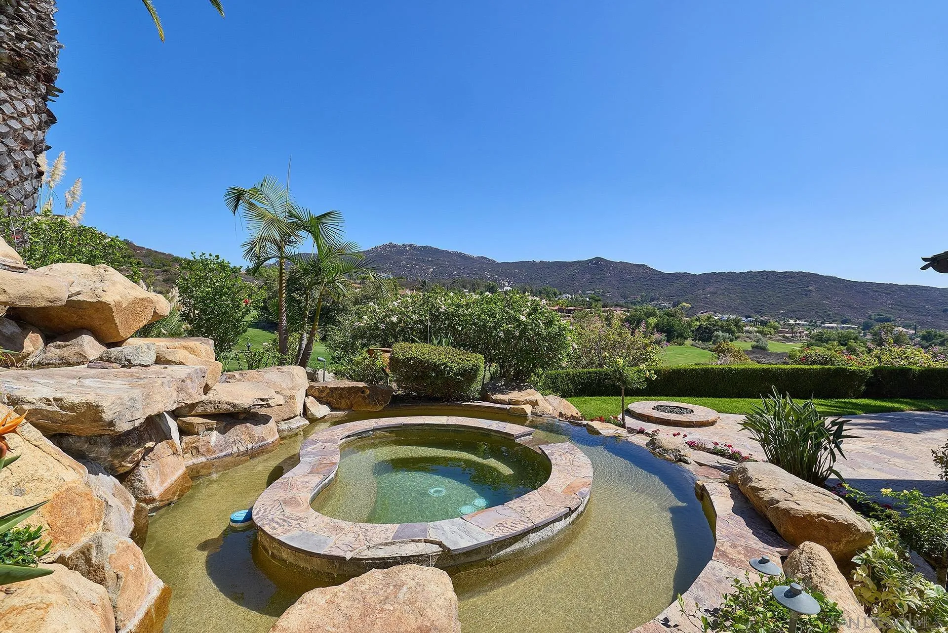 14155 Biscayne Place Poway, CA 92064 - Photo 40 of 56 a swimming pool with outdoor seating and mountain view