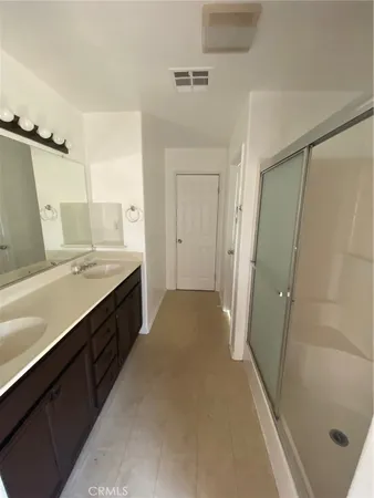 a white toilet sitting next to a window