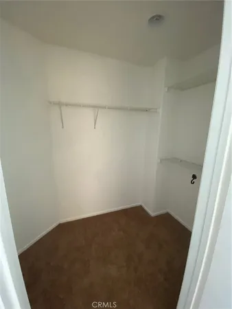 a view of a room with a ceiling fan