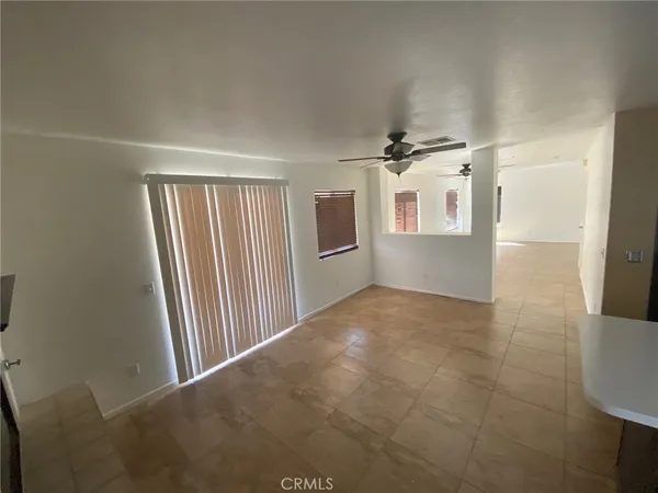 a kitchen with kitchen island a sink a stove and a refrigerator