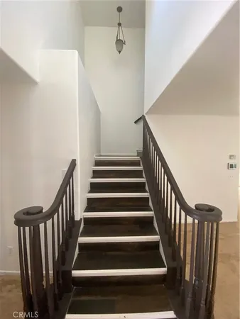 a view of an empty room and a window