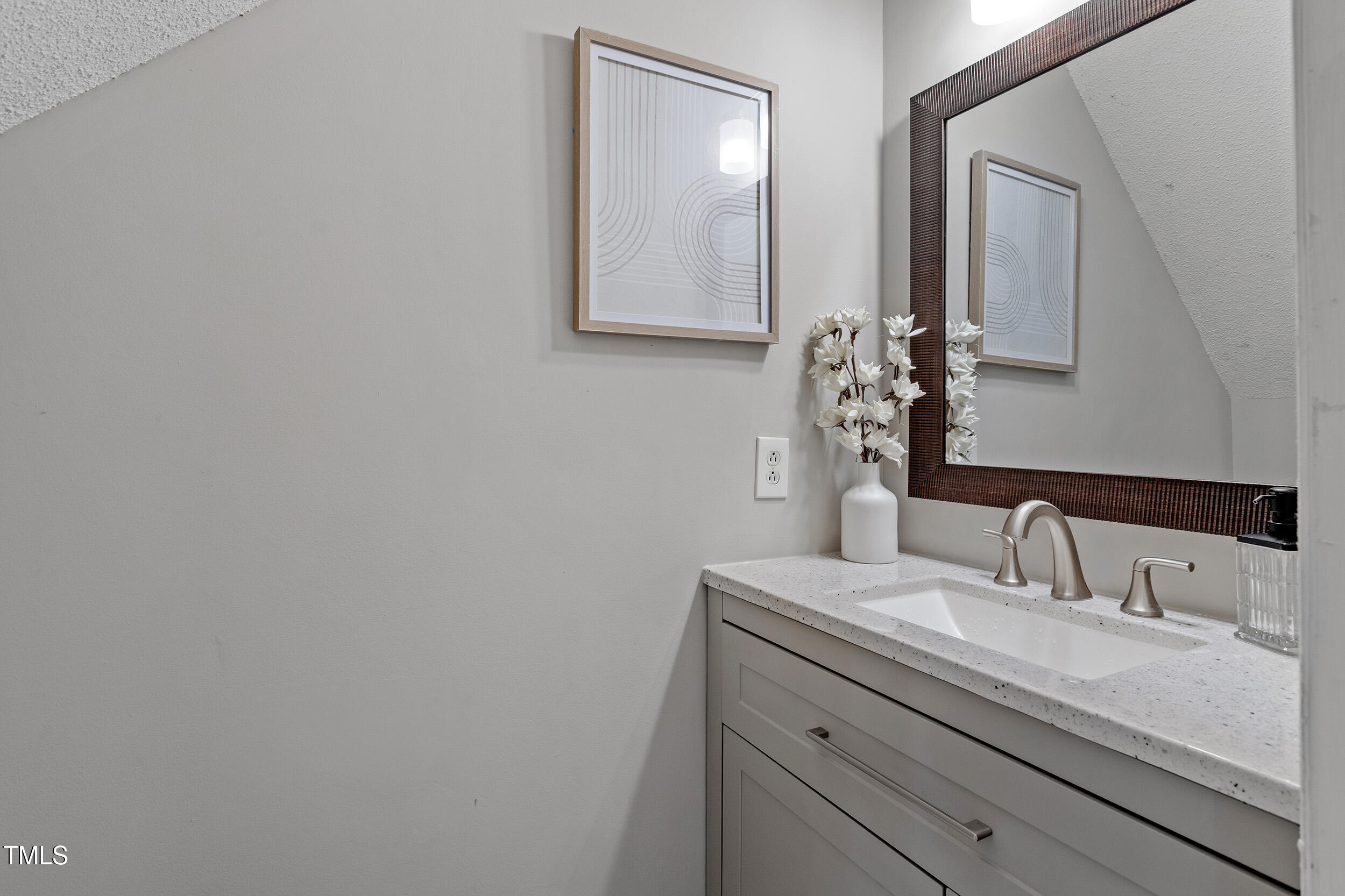 4242 Kaplan Drive Raleigh, NC 27606 - Photo 22 of 30 a bathroom with a sink and a mirror