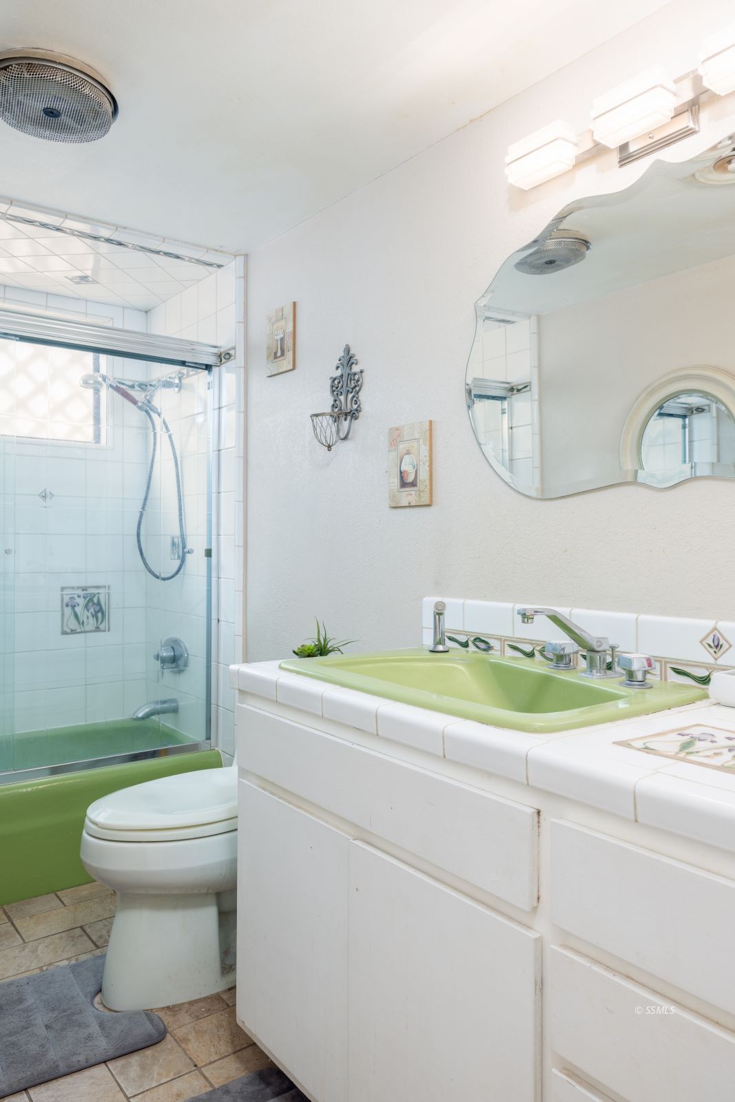 737 Mamie Street Ridgecrest, CA 93555 - Photo 19 of 41 a bathroom with a granite countertop toilet sink and shower