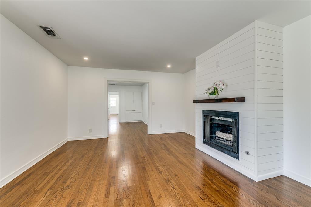 5117 Maple Springs Boulevard Dallas, TX 75235 - Photo 4 of 15 a view of an empty room and wooden floor