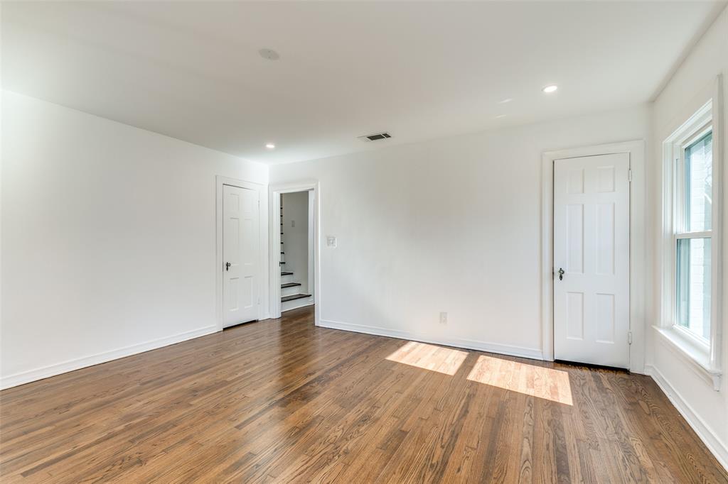 5117 Maple Springs Boulevard Dallas, TX 75235 - Photo 9 of 15 a view of an empty room with wooden floor