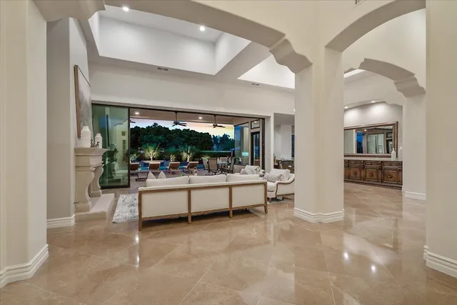 a dining room with furniture window and outside view
