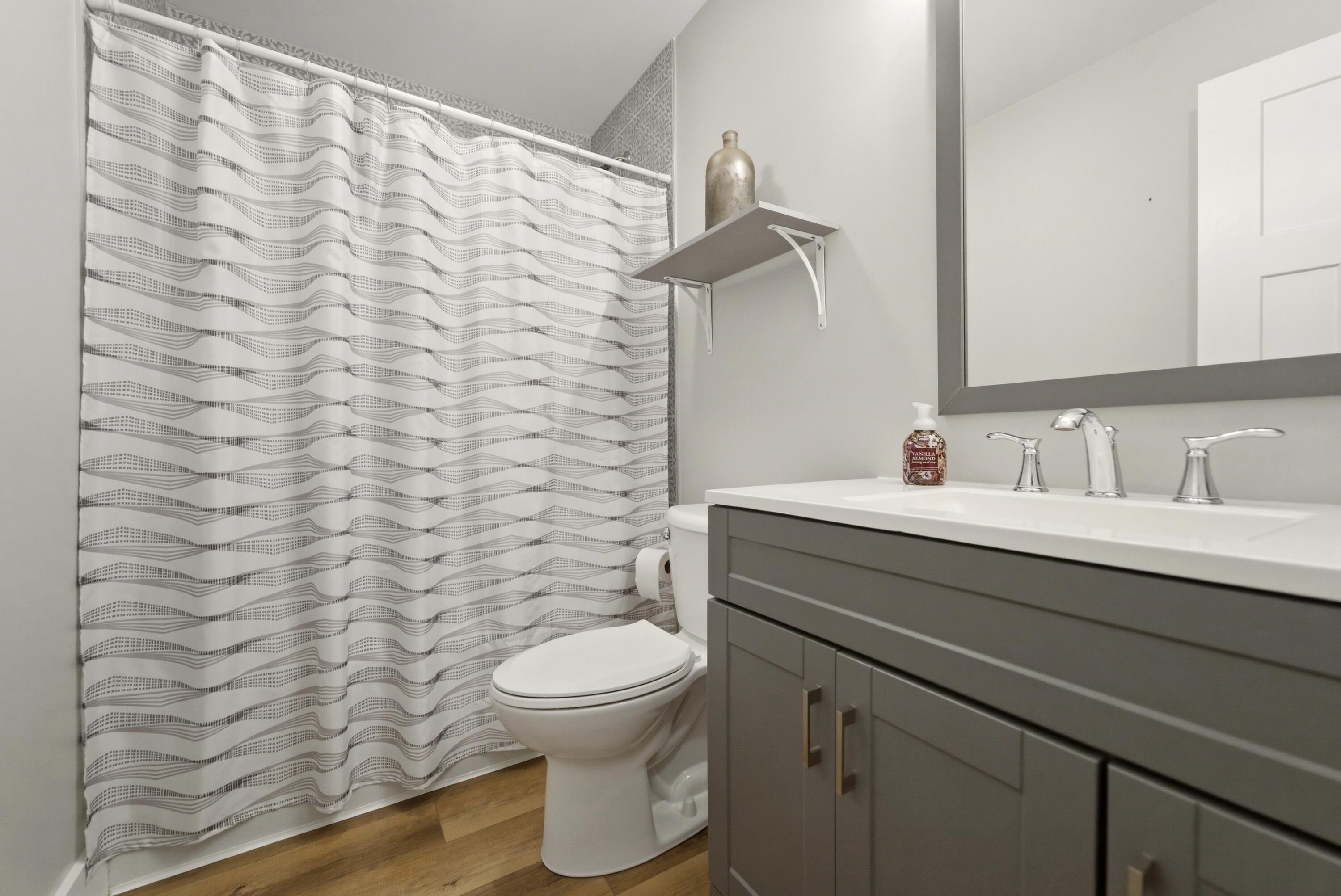 579 Fargo Road Westville, IN 46391 - Photo 13 of 35 a bathroom with a sink a toilet and a mirror