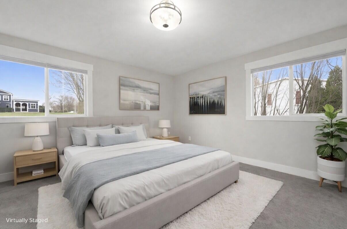 579 Fargo Road Westville, IN 46391 - Photo 19 of 35 a bedroom with a large bed and a potted plant