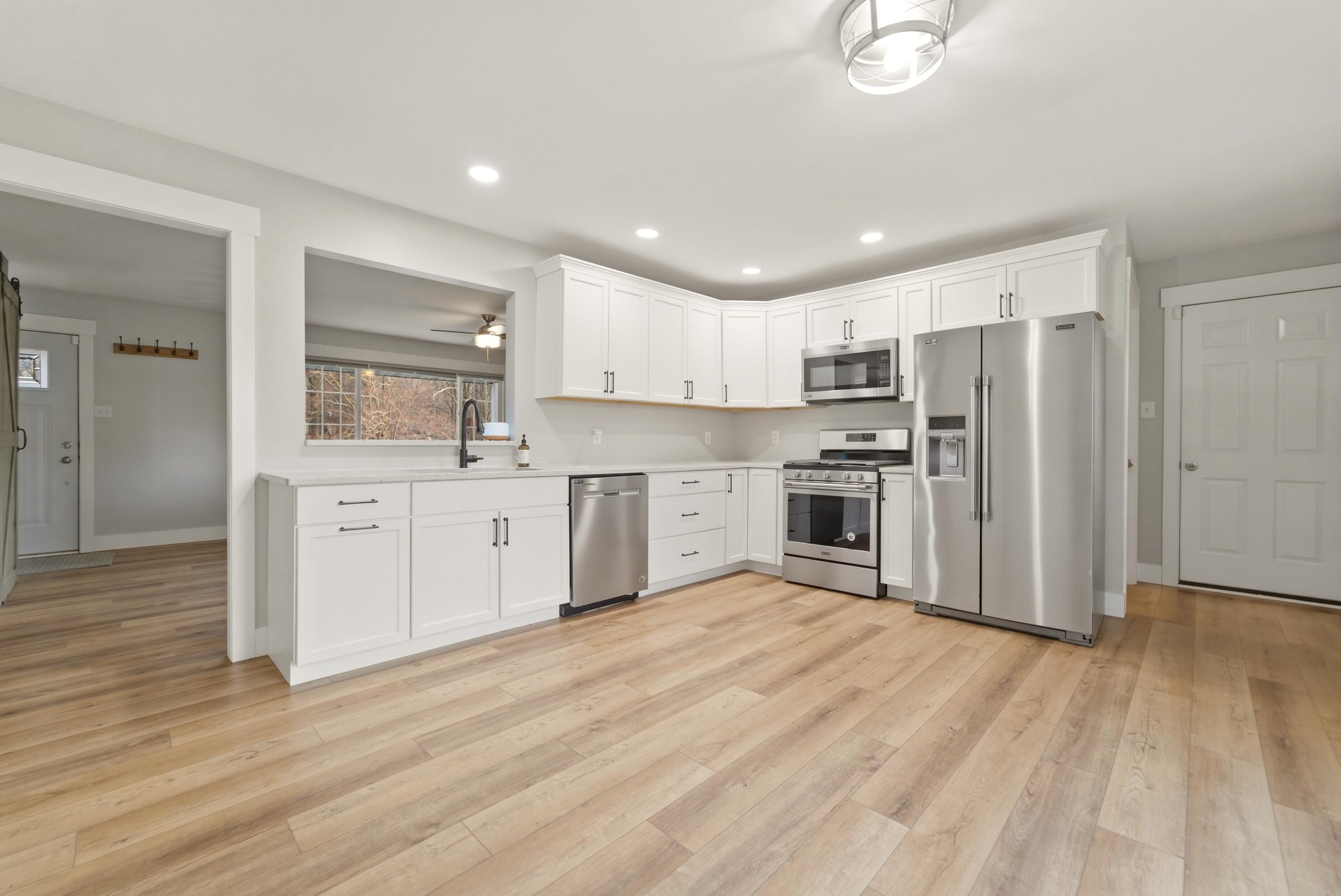 579 Fargo Road Westville, IN 46391 - Photo 2 of 35 a kitchen with stainless steel appliances granite countertop a refrigerator sink and white cabinets