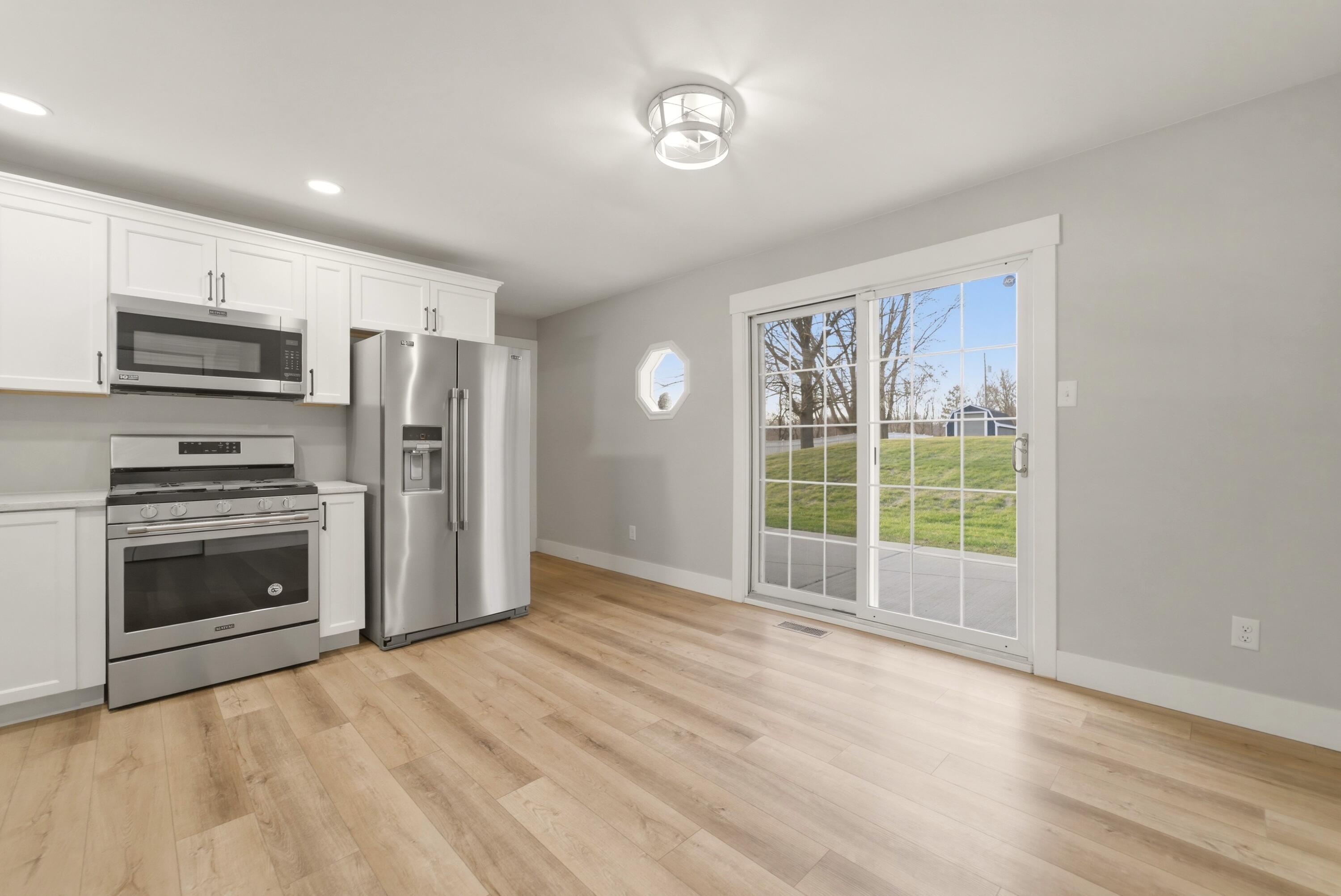 579 Fargo Road Westville, IN 46391 - Photo 3 of 35 a view of kitchen with stainless steel appliances wooden floor and window
