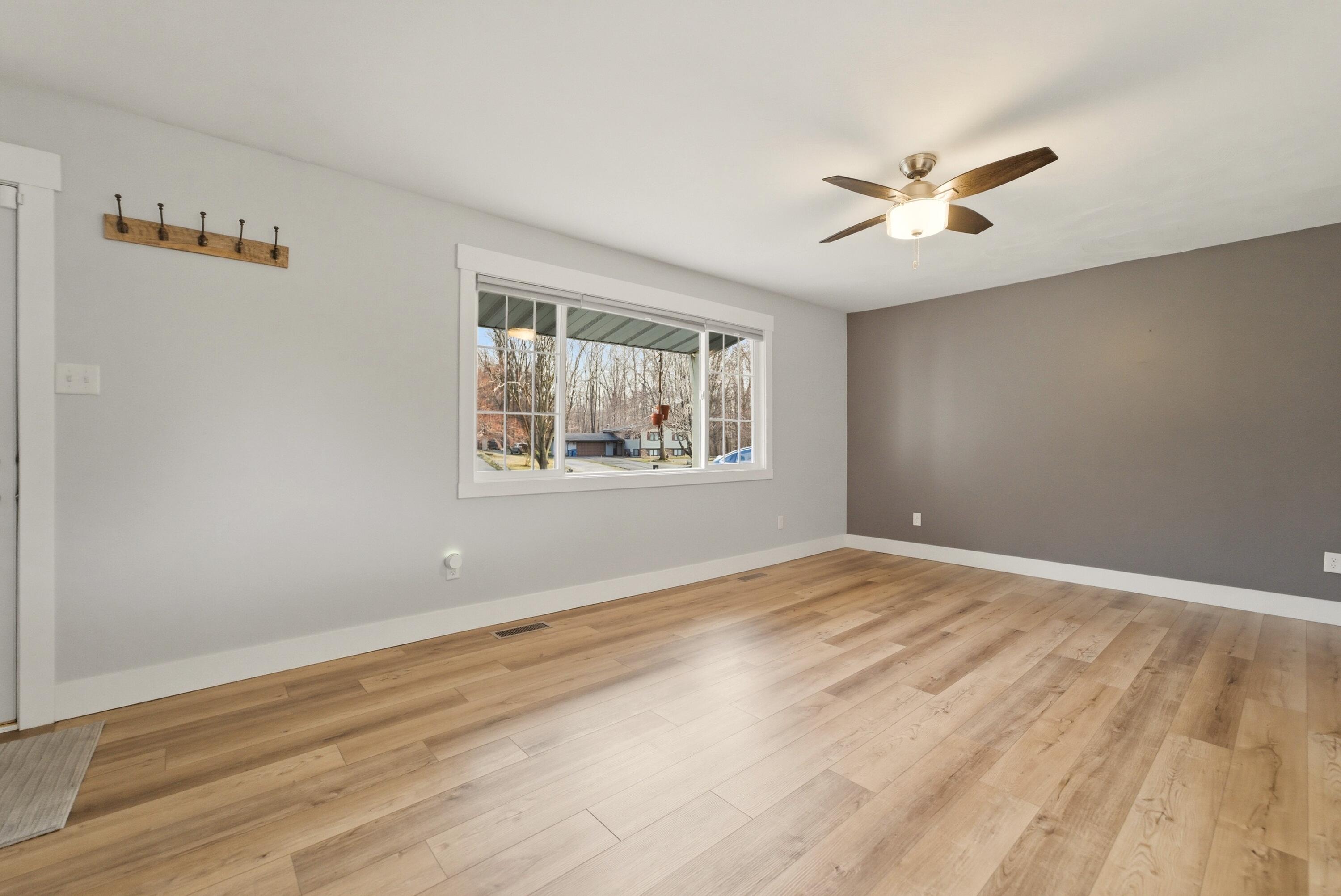 579 Fargo Road Westville, IN 46391 - Photo 9 of 35 a view of empty room with wooden floor and fan