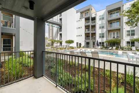 a view of a swimming pool with a lounge chairs