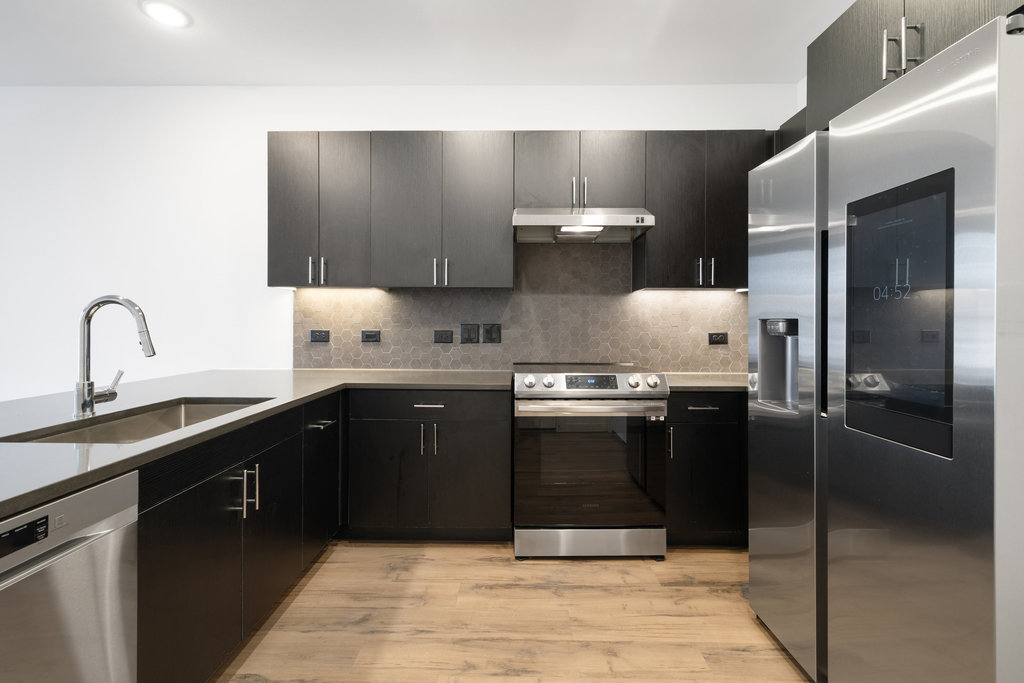 4801 Springdale Road, Unit 1106 Austin, TX 78723 - Photo 3 of 40 a kitchen with a sink and stainless steel appliances