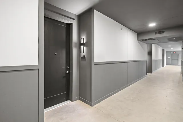 a bathroom with a granite countertop sink a toilet and a mirror