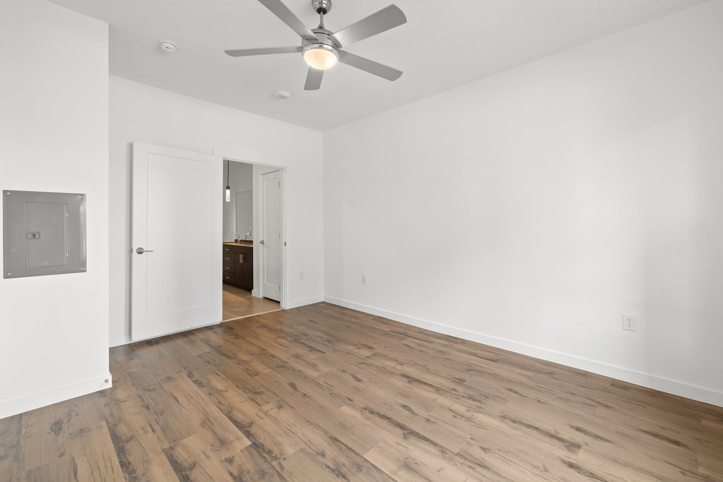 4801 Springdale Road, Unit 1106 Austin, TX 78723 - Photo 38 of 40 a view of an empty room with wooden floor