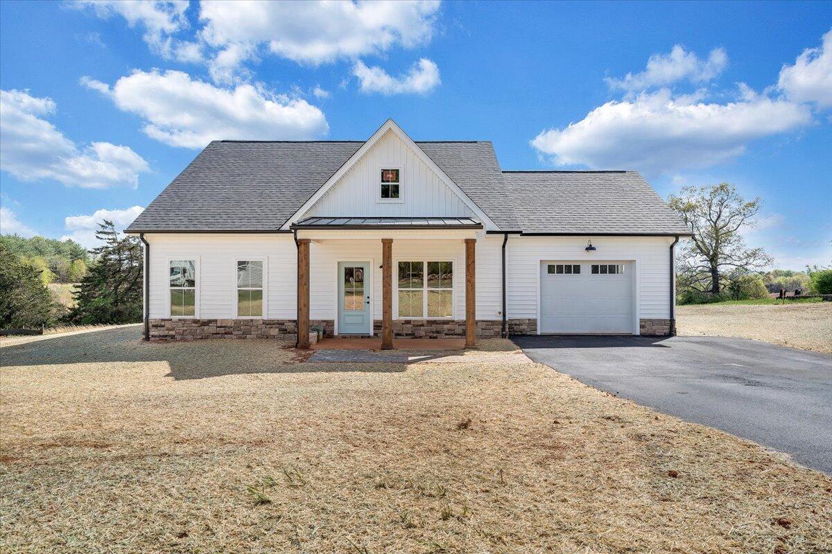 S2-l3 Burnt Chimney Road Wirtz, VA 24184 - Photo 1 of 1 a front view of a house with a yard and garage