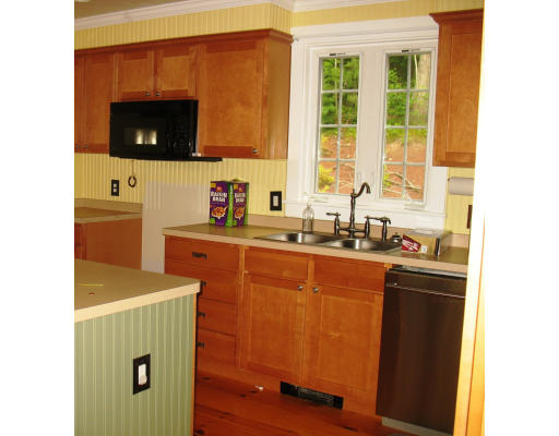102 Charnock Hill Road Rutland, MA 01543 - Photo 5 of 14 a kitchen with sink a microwave and refrigerator