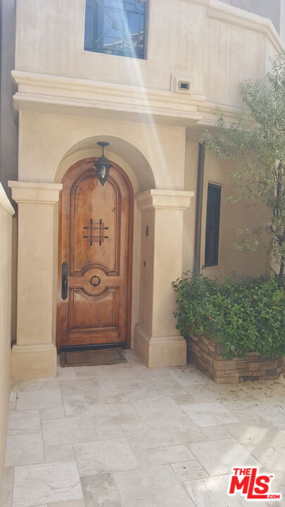 11357 Ovada Place, Unit 2 Los Angeles, CA 90049 - Photo 2 of 13 a front view of a house