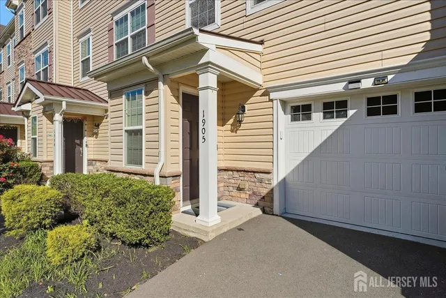 a front view of a house with a garage