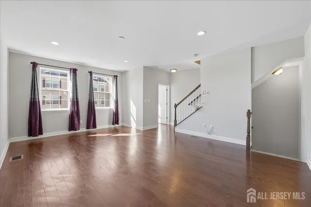 a view of an entryway with wooden floor