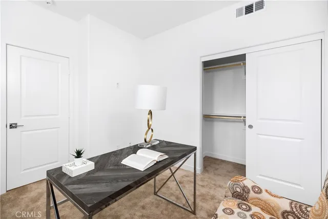 a view of a workspace with furniture