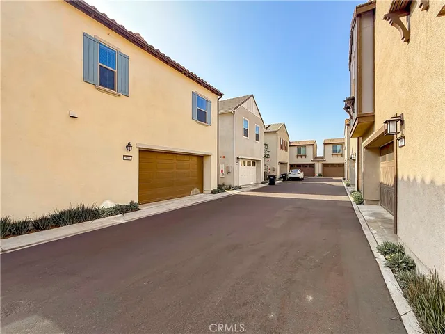 a view of a street with a building in the background