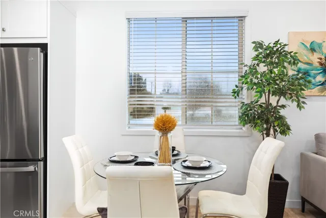 a kitchen with a table and chairs in it