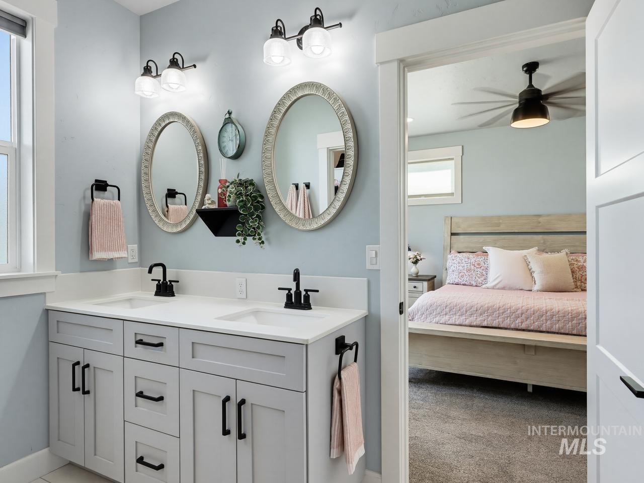 4950 West Columbia Road Nampa, ID 83687 - Photo 25 of 50 Bathroom featuring a dual vanity with light gray cabinetry, white countertops, and matte black fixtures