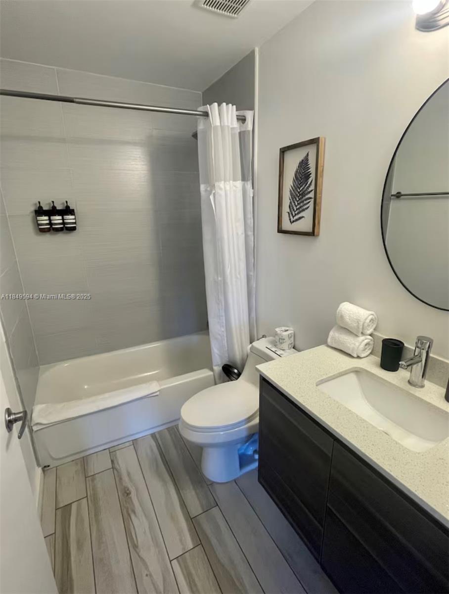 481 Northeast 29th Street, Unit 705 Miami, FL 33137 - Photo 12 of 14 a bathroom with a sink a toilet and shower