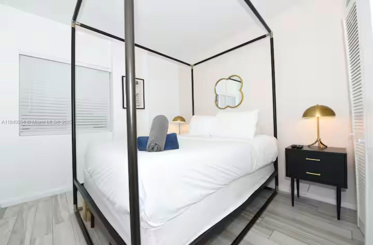 481 Northeast 29th Street, Unit 705 Miami, FL 33137 - Photo 10 of 14 a bathroom with a sink and a mirror