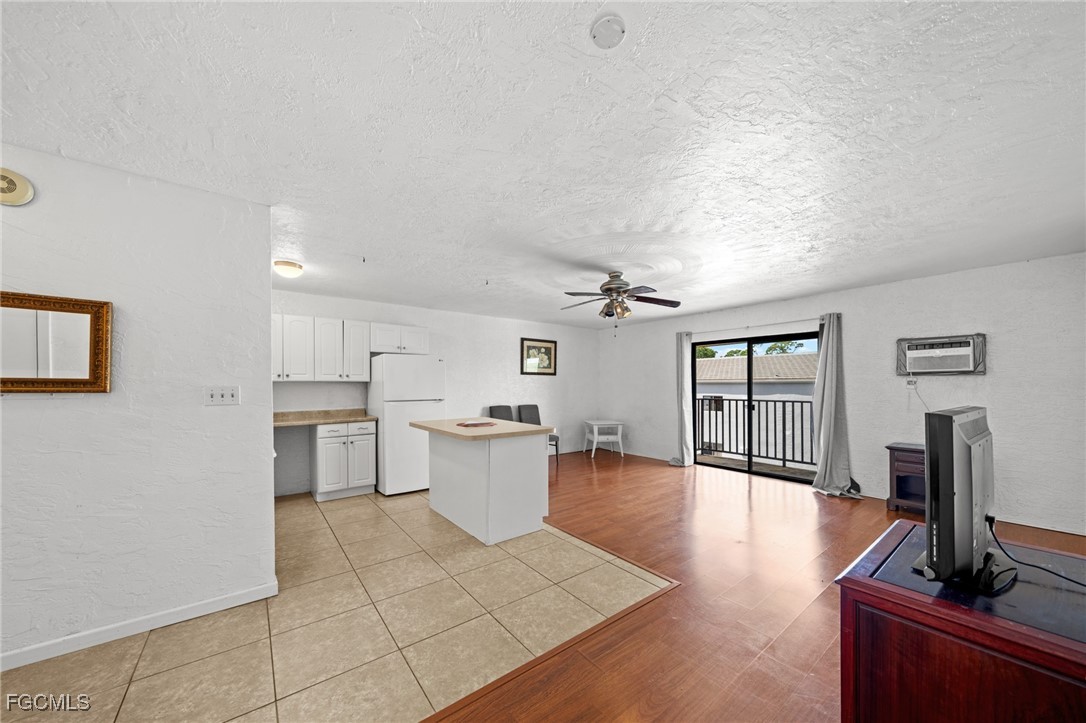 830 Wiggins Pass Road, Unit 14 Naples, FL 34110 - Photo 12 of 20 a view of a living room kitchen and a sink