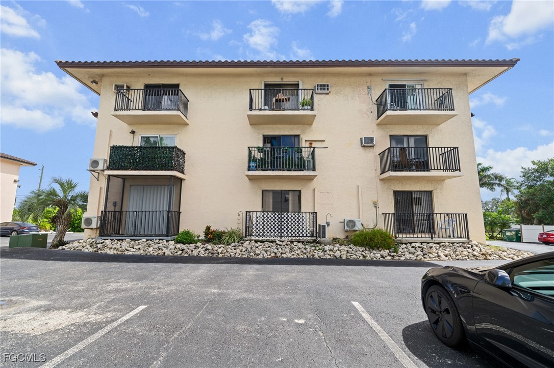 830 Wiggins Pass Road, Unit 14 Naples, FL 34110 - Photo 20 of 20 front view of a house