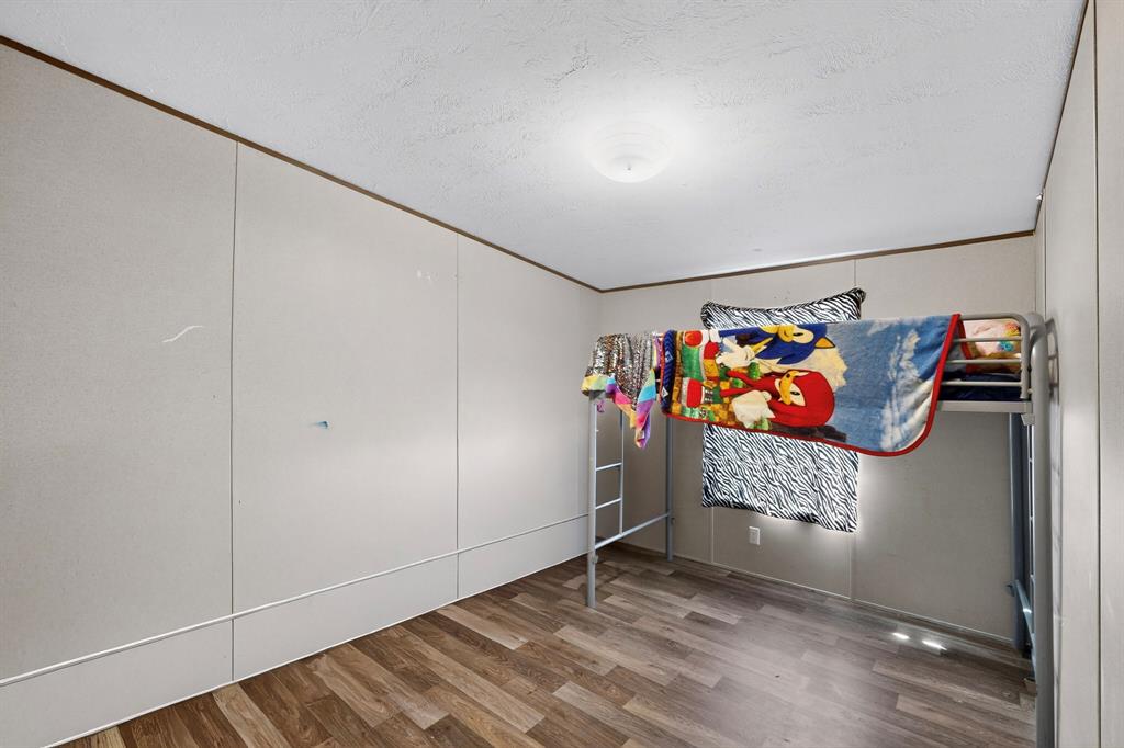 7219 Rucker Street Azle, TX 76020 - Photo 13 of 16 an empty room with painted wall and painting on the wall