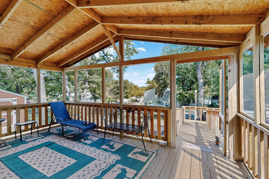 7219 Rucker Street Azle, TX 76020 - Photo 3 of 16 a view of porch with green trees in front