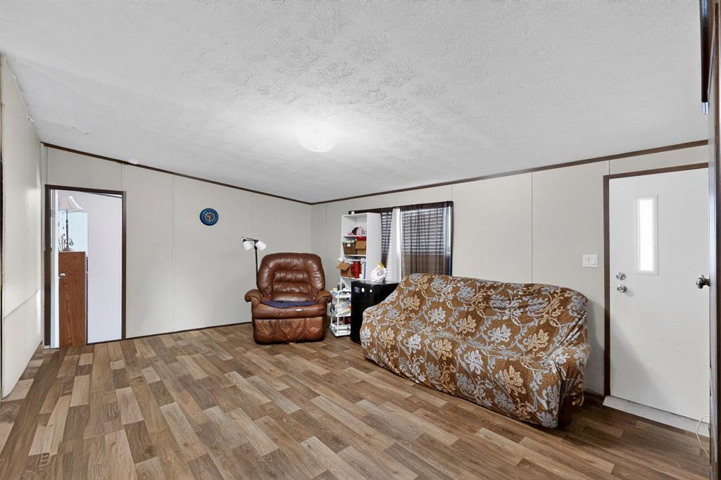 7219 Rucker Street Azle, TX 76020 - Photo 4 of 16 a bedroom with furniture and window