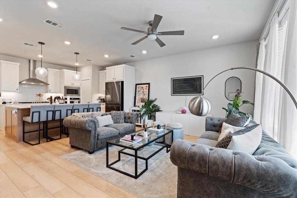 2268 Rook Drive Dallas, TX 75211 - Photo 2 of 13 Open concept living area featuring light hardwood flooring, recessed lighting, and a ceiling fan