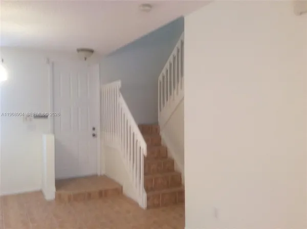a view of hallway with stairs