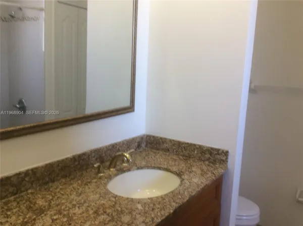 a bathroom with a sink and a toilet