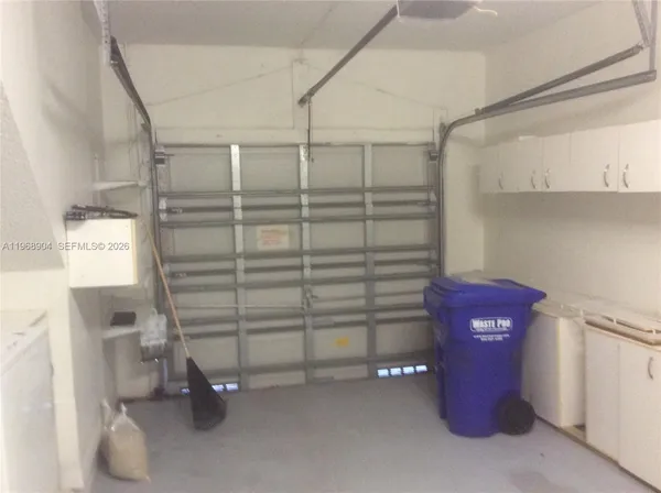 a view of an empty room with empty shelves