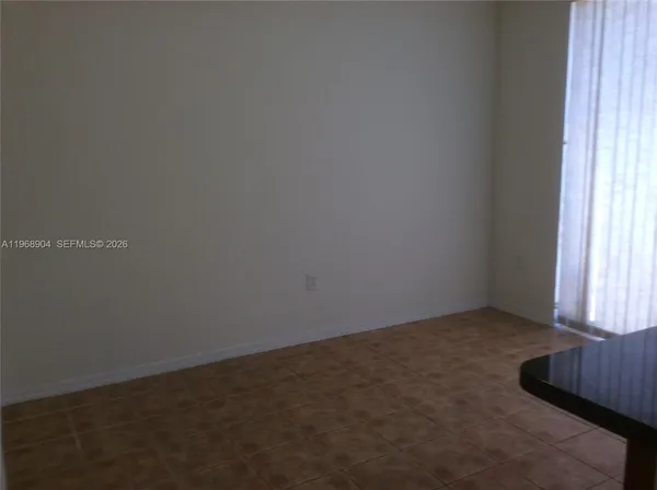 a view of an empty room and window