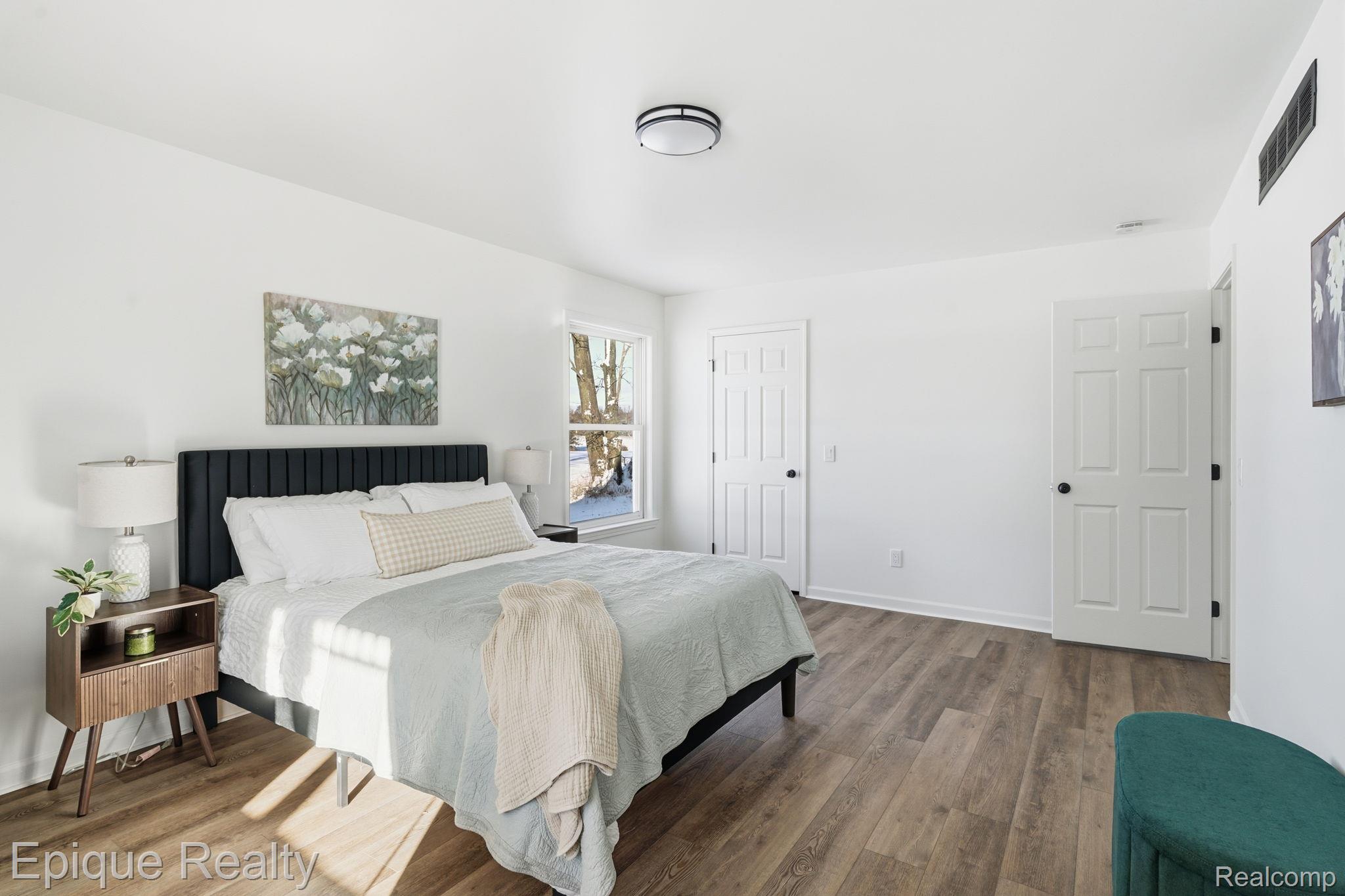 8680 Oakhill Road Clarkston, MI 48348 - Photo 20 of 52 Bedroom featuring wood finished floors and a closet